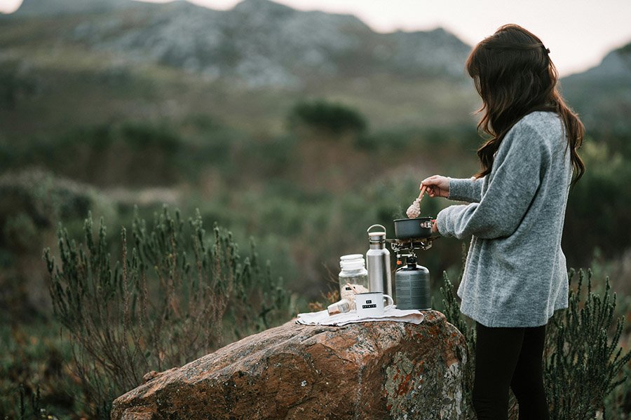 Woman cooking in the wild