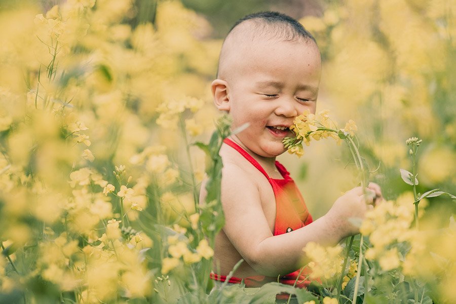 toddler and wild flowers