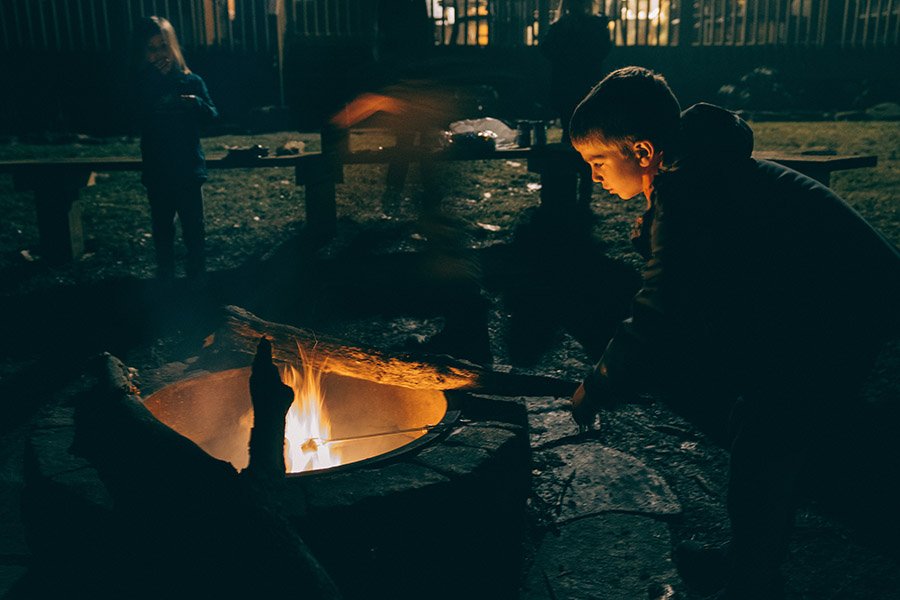 Boy at the campfire